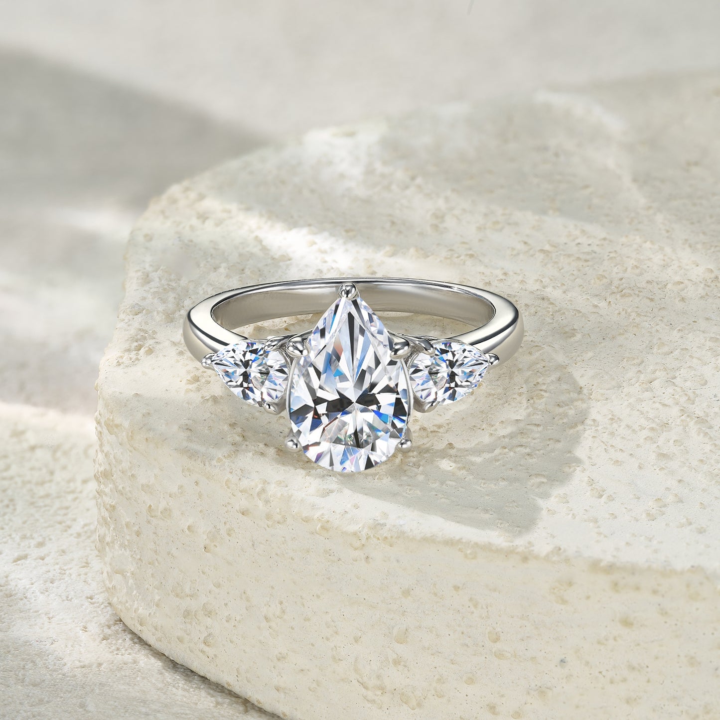 Pear Cut Three-Stone Moissanite Ring
